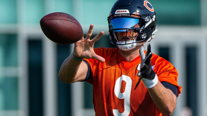 Jul 29, 2021; Lake Forest, IL, USA; Chicago Bears quarterback Nick Foles (9) catches the ball during a Chicago Bears training camp session at Halas Hall. Mandatory Credit: Jon Durr-USA TODAY Sports