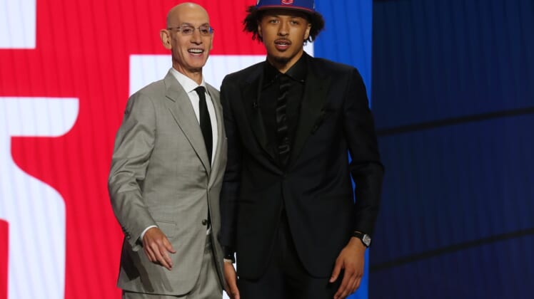 Jul 29, 2021; Brooklyn, New York, USA; Cade Cunningham (Oklahoma State) poses with NBA commissioner Adam Silver after being selected as the number one overall pick by the Detroit Pistons in the first round of the 2021 NBA Draft at Barclays Center. Mandatory Credit: Brad Penner-USA TODAY Sports