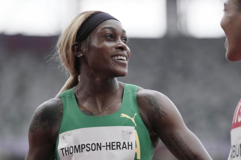 Jul 30, 2021; Tokyo, Japan; Elaine Thompson-Herah (JAM) after competing in the women's 100m preliminary round 1, heat 2during the Tokyo 2020 Olympic Summer Games at Olympic Stadium. Mandatory Credit: James Lang-USA TODAY Sports