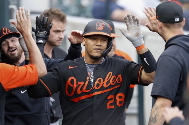 Jul 30, 2021; Detroit, Michigan, USA; Baltimore Orioles catcher Pedro Severino (28) celebrates with teammates in the dugout after hitting a solo home run during the third inning against the Detroit Tigers at Comerica Park. Mandatory Credit: Raj Mehta-USA TODAY Sports