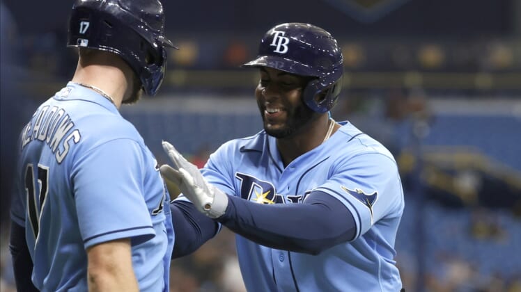 Jul 30, 2021; St. Petersburg, Florida, USA; Tampa Bay Rays first baseman Yandy Diaz (2) is congratulated by Tampa Bay Rays left fielder Austin Meadows (17) after he hit a two run home run during the first inning against the Boston Red Sox at Tropicana Field. Mandatory Credit: Kim Klement-USA TODAY Sports