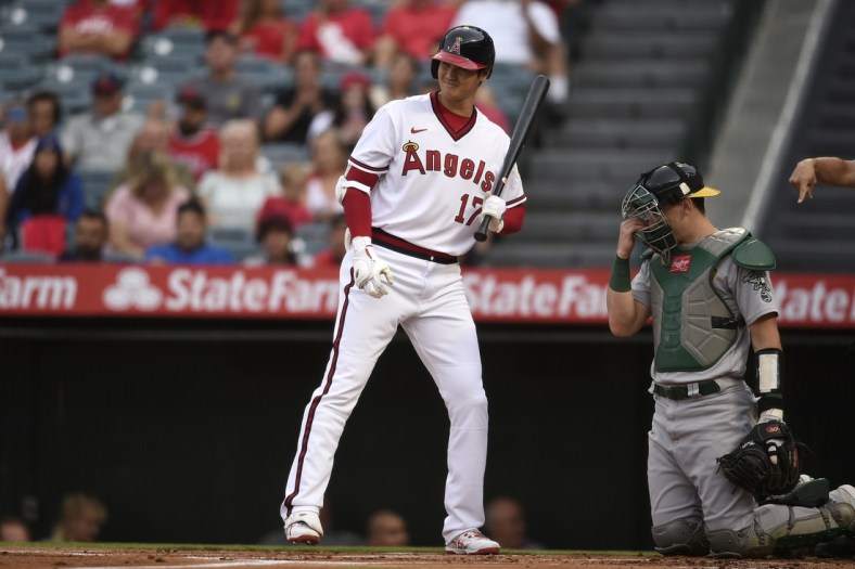 Jul 30, 2021; Anaheim, California, USA; Los Angeles Angels designated hitter Shohei Ohtani (17) reacts during his at-bat during the first inning against the Oakland Athletics at Angel Stadium. Mandatory Credit: Kelvin Kuo-USA TODAY Sports