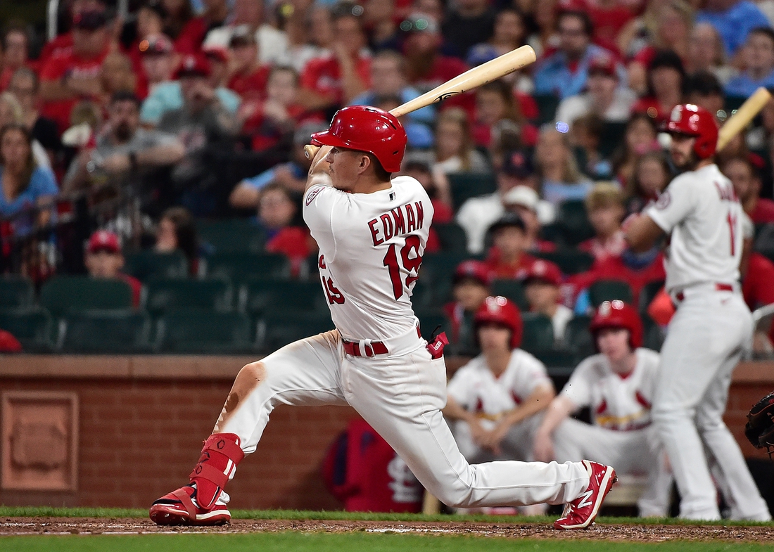 Jul 30, 2021; St. Louis, Missouri, USA;  St. Louis Cardinals second baseman Tommy Edman (19) hits a three run double during the sixth inning against the Minnesota Twins at Busch Stadium. Mandatory Credit: Jeff Curry-USA TODAY Sports