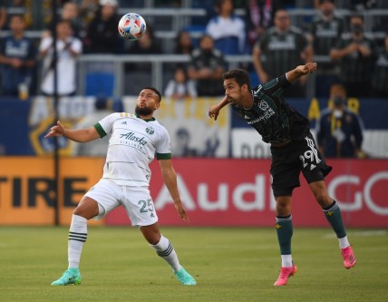 Jul 30, 2021; Carson, California, USA;  Portland Timbers defender Bill Tuiloma (25) and Los Angeles Galaxy forward Ethan Zubak (29) battle for the ball battle for the ball in the first half of the game at StubHub Center. Mandatory Credit: Jayne Kamin-Oncea-USA TODAY Sports