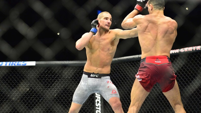 Oct 27, 2018; Moncton, Canada; Nordine Taleb (red gloves) fights Sean Strickland (blue gloves) during UFC Fight Night at Moncton Events Centre. Mandatory Credit: Trevor MacMillan-USA TODAY Sports