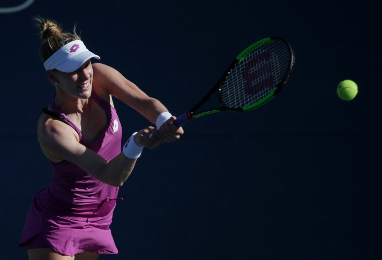 Aug 29, 2019; Flushing, NY, USA; Alison Riske of the United States returns a shot against Jelena Ostapenko of Latvia in a second round match on day four of the 2019 U.S. Open tennis tournament at USTA Billie Jean King National Tennis Center. Mandatory Credit: Jerry Lai-USA TODAY Sports