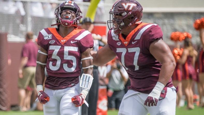 Sep 7, 2019; Blacksburg, VA, USA; Virginia Tech Hokies running back Keshawn King (35) celebrates his first touch down with Christian Darrisaw (77) in the first period against the Old Dominion Monarchs at Lane Stadium. Mandatory Credit: Lee Luther Jr.-USA TODAY Sports