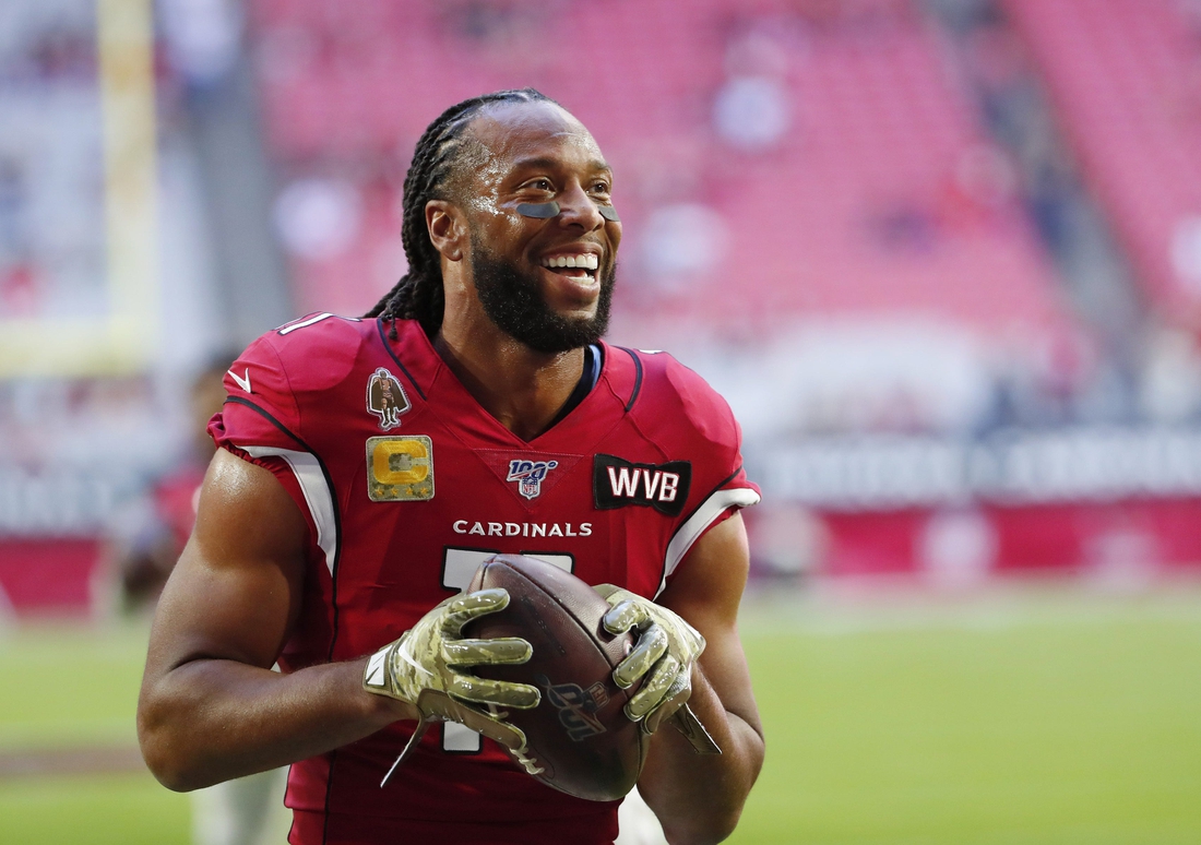 Arizona Cardinals wide receiver Larry Fitzgerald (11) jokes with fans before playing against the Los Angeles Rams at State Farm Stadium December 1, 2019.

Rams Vs Cardinals