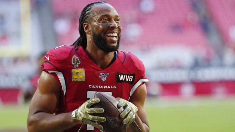 Arizona Cardinals wide receiver Larry Fitzgerald (11) jokes with fans before playing against the Los Angeles Rams at State Farm Stadium December 1, 2019.

Rams Vs Cardinals