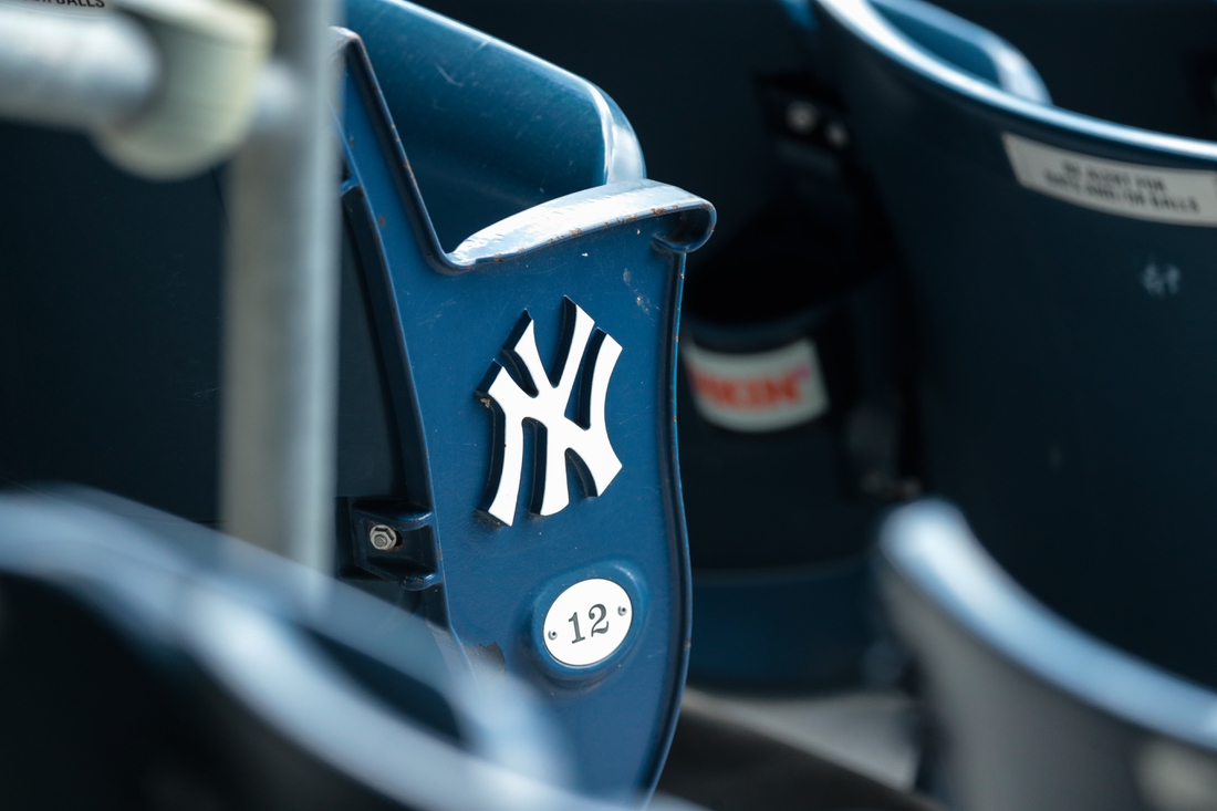 Jul 12, 2020; Bronx, New York, United States; A view of the  New York Yankees logo and seat number of an empty seat during a simulated game during summer camp workouts at Yankee Stadium. Mandatory Credit: Vincent Carchietta-USA TODAY Sports