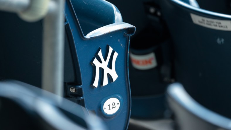 Jul 12, 2020; Bronx, New York, United States; A view of the  New York Yankees logo and seat number of an empty seat during a simulated game during summer camp workouts at Yankee Stadium. Mandatory Credit: Vincent Carchietta-USA TODAY Sports