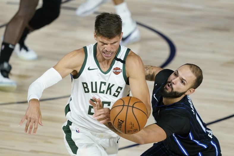 Aug 24, 2020; Lake Buena Vista, Florida, USA; Orlando Magic's Evan Fournier (right) tries to steal the ball from Milwaukee Bucks' Kyle Korver (26) during the first half in game four of the first round of the 2020 NBA Playoffs at The Field House. Mandatory Credit: Ashley Landis/Pool Photo-USA TODAY Sports

 Monday, Aug. 24, 2020, in Lake Buena Vista, Fla. (AP Photo/Ashley Landis, Pool)