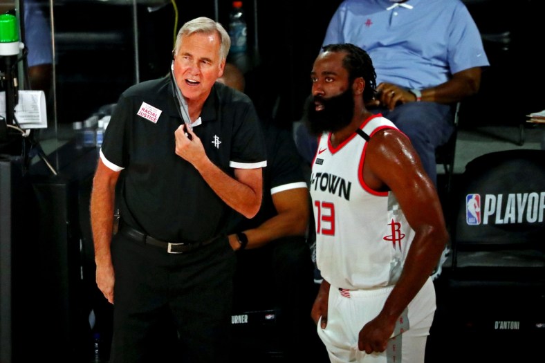Sep 4, 2020; Lake Buena Vista, Florida, USA; Houston Rockets head coach Mike D'Antoni and guard James Harden (13) talks during the second quarter against the Los Angeles Lakers in game one of the second round of the 2020 NBA Playoffs at AdventHealth Arena. Mandatory Credit: Kim Klement-USA TODAY Sports