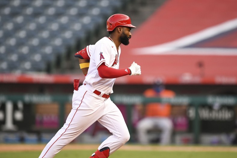 Sep 5, 2020; Anaheim, California, USA; Los Angeles Angels right fielder Jo Adell (59) hits a solo home run against the Houston Astros during the game at Angel Stadium. Mandatory Credit: Angels Baseball/Pool Photo via USA TODAY Network