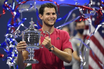 Sep 13 2020; Flushing Meadows, New York, USA; Dominic Thiem of Austria celebrates with the championship trophy after his match against Alexander Zverev of Germany (not pictured) in the men's singles final match on day fourteen of the 2020 U.S. Open tennis tournament at USTA Billie Jean King National Tennis Center. Mandatory Credit: Danielle Parhizkaran-USA TODAY Sports