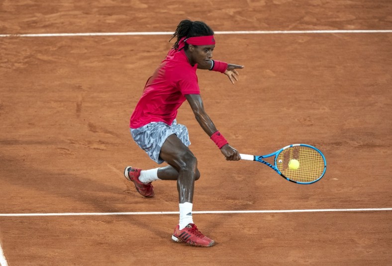 Sep 29, Paris, France; Mikael Ymer (SWE) in action during his match against Novak Djokovic (SRB) on day three at Stade Roland Garros. Mandatory Credit: Susan Mullane-USA TODAY Sports