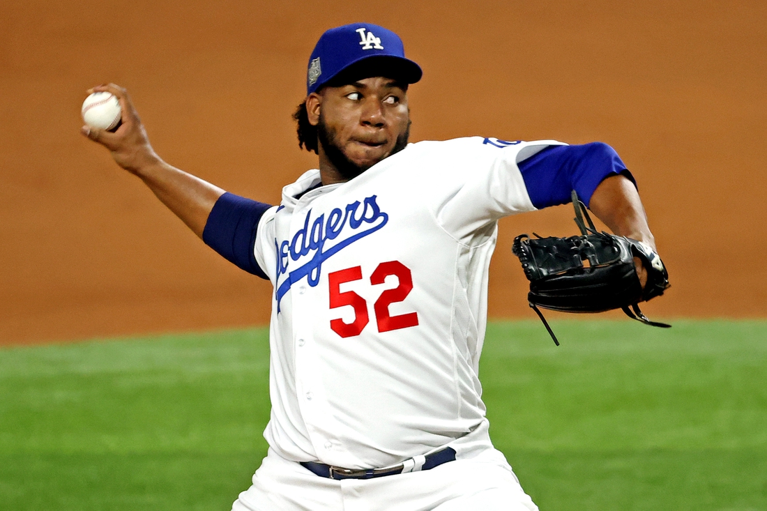 Oct 27, 2020; Arlington, Texas, USA; Los Angeles Dodgers relief pitcher Pedro Baez (52) pitches during the fifth inning against the Tampa Bay Rays during game six of the 2020 World Series at Globe Life Field. Mandatory Credit: Kevin Jairaj-USA TODAY Sports