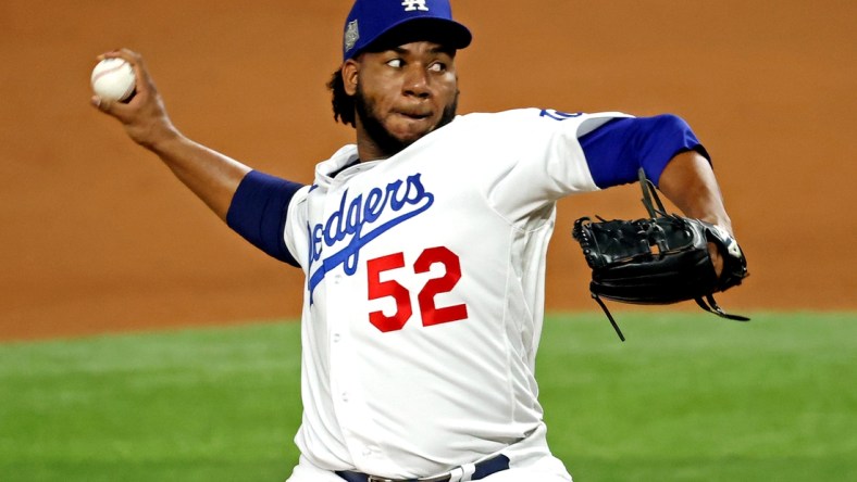 Oct 27, 2020; Arlington, Texas, USA; Los Angeles Dodgers relief pitcher Pedro Baez (52) pitches during the fifth inning against the Tampa Bay Rays during game six of the 2020 World Series at Globe Life Field. Mandatory Credit: Kevin Jairaj-USA TODAY Sports