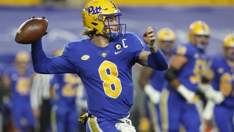 Nov 21, 2020; Pittsburgh, Pennsylvania, USA;  Pittsburgh Panthers quarterback Kenny Pickett (8) passes against the Virginia Tech Hokies during the second quarter at Heinz Field. Pittsburgh won 47-14. Mandatory Credit: Charles LeClaire-USA TODAY Sports