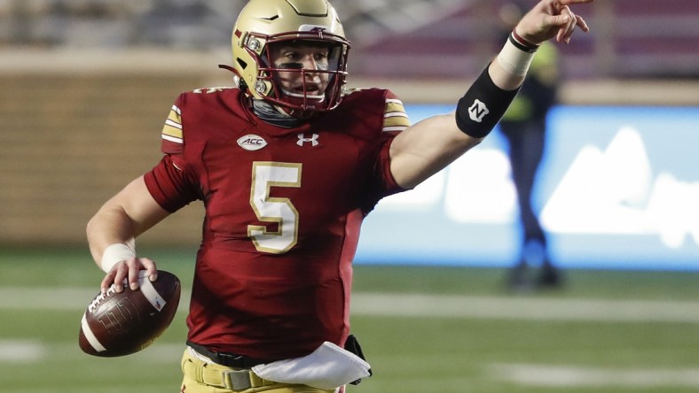 Nov 28, 2020; Chestnut Hill, Massachusetts, USA; Boston College Eagles quarterback Phil Jurkovec (5) directs his receivers during the first half against the Louisville Cardinals at Alumni Stadium. Mandatory Credit: Winslow Townson-USA TODAY Sports