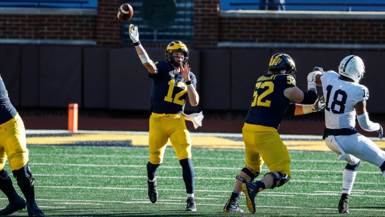 Michigan quarterback Cade McNamara makes a pass against Penn State during the second half of Michigan's 27-17 loss at Michigan Stadium on Saturday, Nov. 28, 2020.