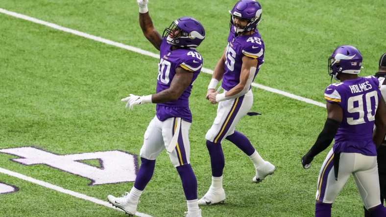 Dec 20, 2020; Minneapolis, Minnesota, USA; Minnesota Vikings linebacker Todd Davis (40) celebrates his sack with linebacker Troy Dye (45) during the first quarter against the Chicago Bears at U.S. Bank Stadium. Mandatory Credit: Brace Hemmelgarn-USA TODAY Sports