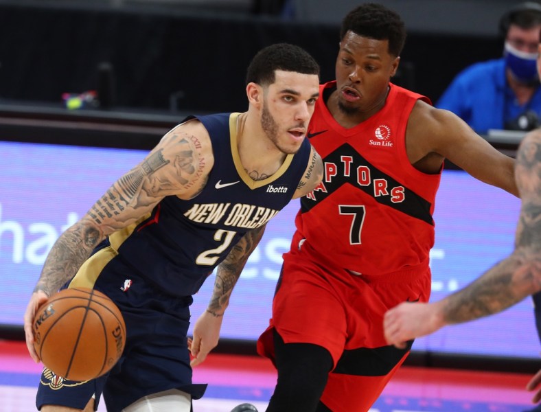 Dec 23, 2020; Tampa, Florida, USA;  New Orleans Pelicans guard Lonzo Ball (2) drives to the basket as Toronto Raptors guard Kyle Lowry (7) defends during the first quarter at Amalie Arena. Mandatory Credit: Kim Klement-USA TODAY Sports