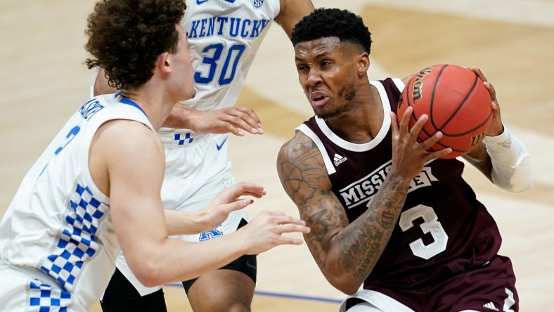 Mississippi State guard D.J. Stewart Jr. (3) looks to pass past Kentucky guard Devin Askew (2) during the second half of the SEC Men's Basketball Tournament game at Bridgestone Arena in Nashville, Tenn., Thursday, March 11, 2021.

Uk Ms Sec 031121 An 033