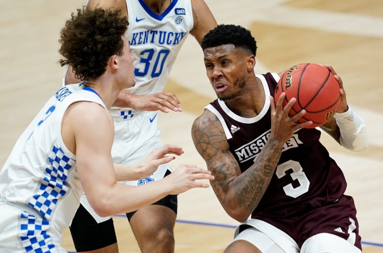 Mississippi State guard D.J. Stewart Jr. (3) looks to pass past Kentucky guard Devin Askew (2) during the second half of the SEC Men's Basketball Tournament game at Bridgestone Arena in Nashville, Tenn., Thursday, March 11, 2021.

Uk Ms Sec 031121 An 033