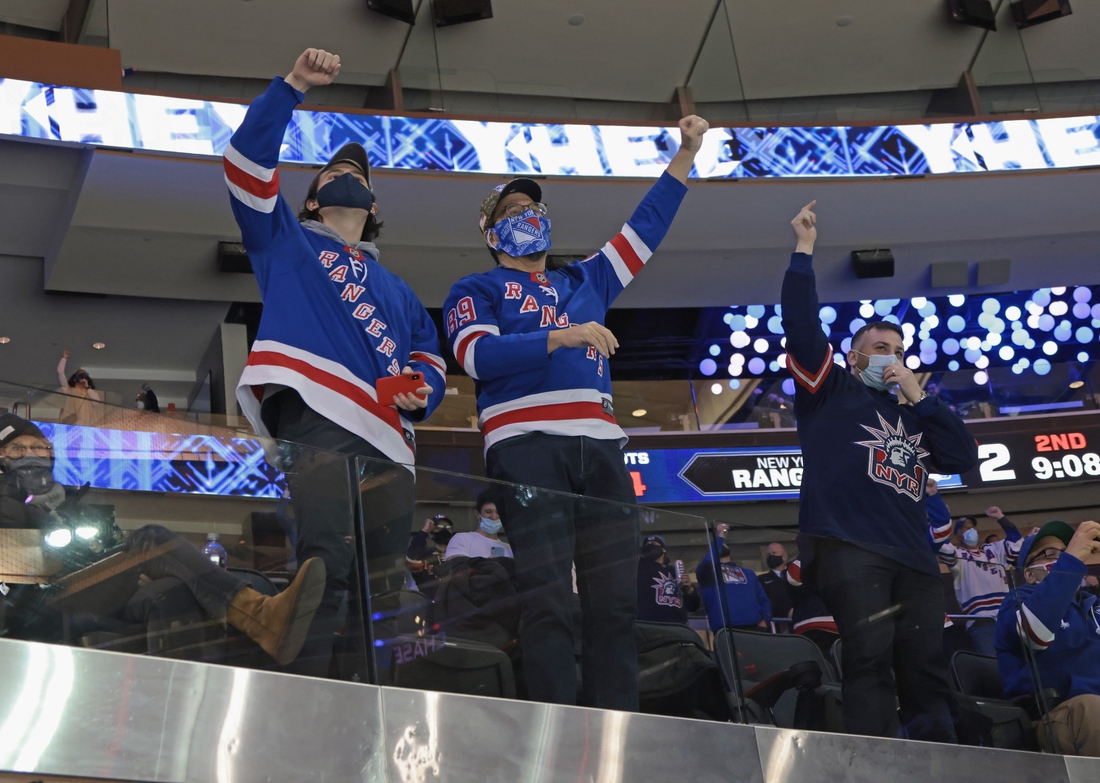 Mar 15, 2021; New York, New York, USA; New York Rangers fans celebrate a second period goal by Colin Blackwell #43 against the Philadelphia Flyers at Madison Square Garden on March 15, 2021 in New York City. Mandatory Credit:  Bruce Bennett/POOL PHOTOS-USA TODAY Sports