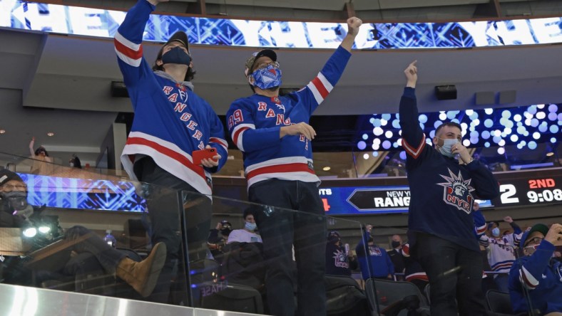 Mar 15, 2021; New York, New York, USA; New York Rangers fans celebrate a second period goal by Colin Blackwell #43 against the Philadelphia Flyers at Madison Square Garden on March 15, 2021 in New York City. Mandatory Credit:  Bruce Bennett/POOL PHOTOS-USA TODAY Sports