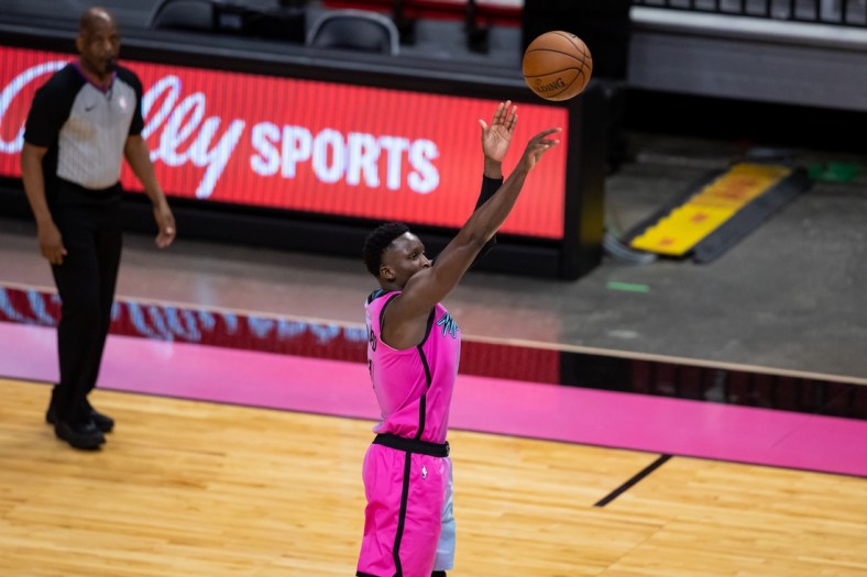 Apr 1, 2021; Miami, Florida, USA; Miami Heat guard Victor Oladipo (4) attempts a three-point shot during the second quarter of a game against the Golden State Warriors at American Airlines Arena. Mandatory Credit: Mary Holt-USA TODAY Sports