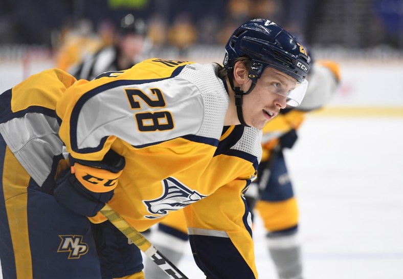Apr 3, 2021; Nashville, Tennessee, USA; Nashville Predators right wing Eeli Tolvanen (28) lines up for a face off during the first period against the Chicago Blackhawks at Bridgestone Arena. Mandatory Credit: Christopher Hanewinckel-USA TODAY Sports