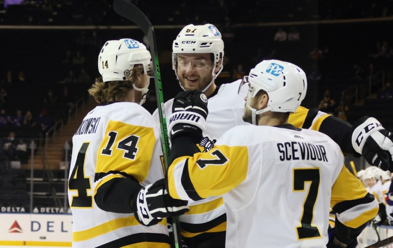 Apr 8, 2021; New York, New York, USA; Pittsburgh Penguins left wing Radim Zohorna (67) celebrates with center Mark Jankowski (14) and center Colton Sceviour (7) his goal scored against the New York Rangers during the first period at Madison Square Garden. Mandatory Credit:  Bruce Bennett/Pool Photo-USA TODAY Sports