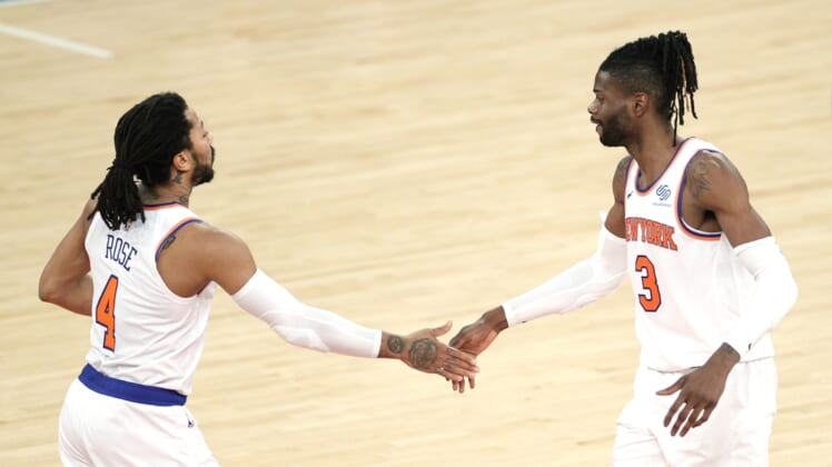 Apr 20, 2021; New York, New York, USA;  Nerlens Noel #3 and Derrick Rose #4 of the New York Knicks high-five during the second half against the Charlotte Hornets at Madison Square Garden. Mandatory Credit:  Sarah Stier/POOL PHOTOS-USA TODAY Sports