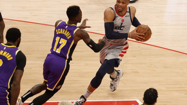 Apr 28, 2021; Washington, District of Columbia, USA; Washington Wizards guard Russell Westbrook (4) drives to the basket as Los Angeles Lakers guard Dennis Schroder (17) defends in the first quarter at Capital One Arena. Mandatory Credit: Geoff Burke-USA TODAY Sports