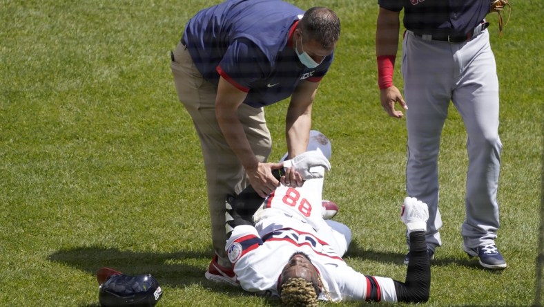 May 2, 2021; Chicago, Illinois, USA; Chicago White Sox center fielder Luis Robert (88) is hurt after beating out an infield single against the Cleveland Indians during the first inning at Guaranteed Rate Field. Mandatory Credit: David Banks-USA TODAY Sports