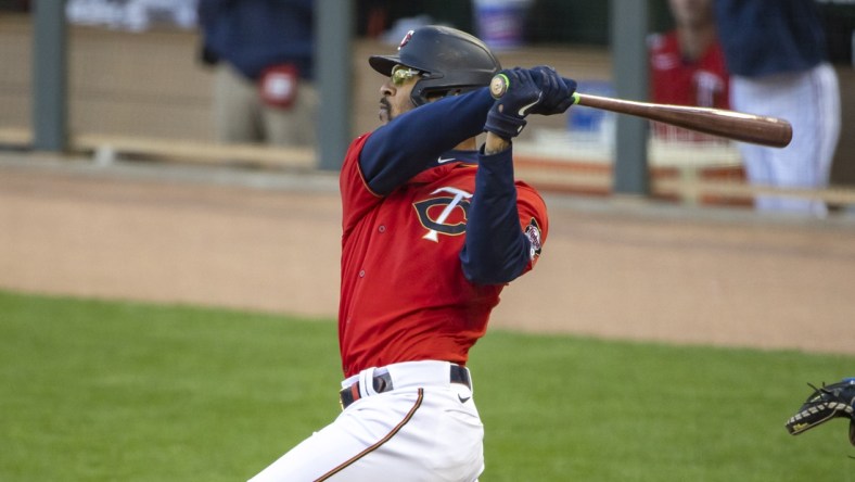 May 4, 2021; Minneapolis, Minnesota, USA; Minnesota Twins center fielder Byron Buxton (25) hits a two-run home run in the first inning against the Texas Rangers at Target Field. Mandatory Credit: Jesse Johnson-USA TODAY Sports