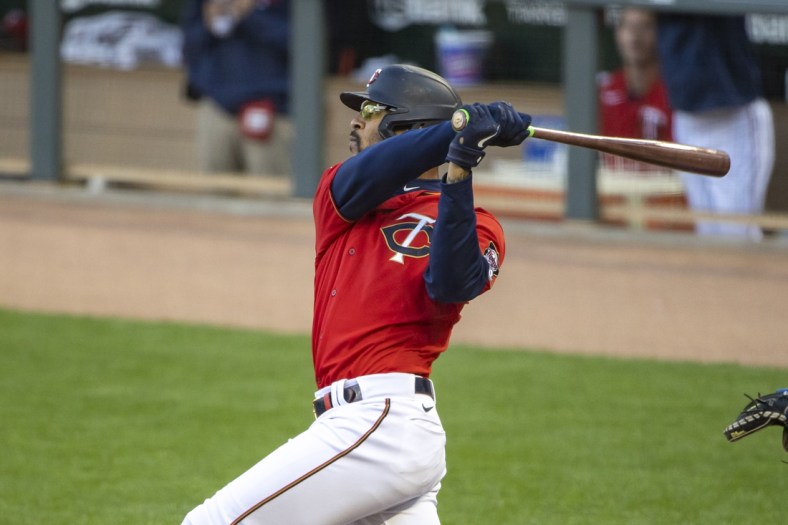 May 4, 2021; Minneapolis, Minnesota, USA; Minnesota Twins center fielder Byron Buxton (25) hits a two-run home run in the first inning against the Texas Rangers at Target Field. Mandatory Credit: Jesse Johnson-USA TODAY Sports