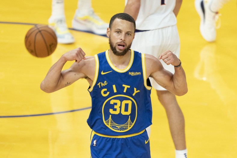 May 11, 2021; San Francisco, California, USA; Golden State Warriors guard Stephen Curry (30) celebrates after making a basket against the Phoenix Suns during the third quarter at Chase Center. Mandatory Credit: Kyle Terada-USA TODAY Sports