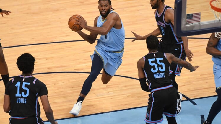 May 14, 2021; Memphis, Tennessee, USA; Memphis Grizzlies forward Justise Winslow (7) drives to the basket during the first quarter against the Sacramento Kings at FedExForum. Mandatory Credit: Christopher Hanewinckel-USA TODAY Sports