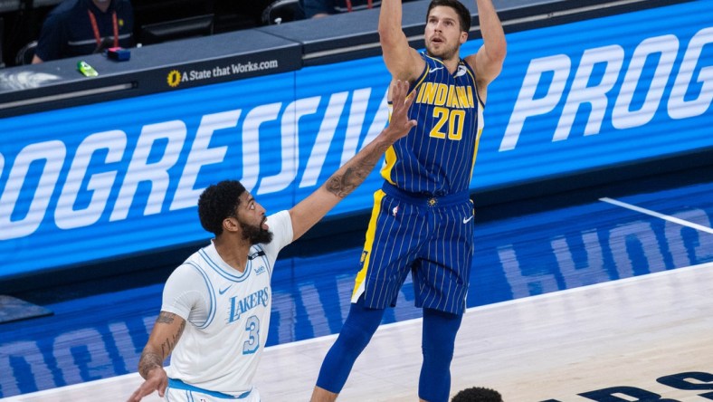 May 15, 2021; Indianapolis, Indiana, USA; Indiana Pacers forward Doug McDermott (20) shoots the ball while Los Angeles Lakers forward Anthony Davis (3) defends in the first quarter at Bankers Life Fieldhouse. Mandatory Credit: Trevor Ruszkowski-USA TODAY Sports