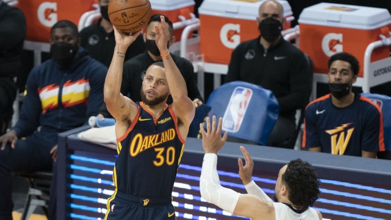 May 21, 2021; San Francisco, CA, USA; Golden State Warriors guard Stephen Curry (30) shoots the basketball against Memphis Grizzlies forward Dillon Brooks (24) during the third quarter at Chase Center. Mandatory Credit: Kyle Terada-USA TODAY Sports