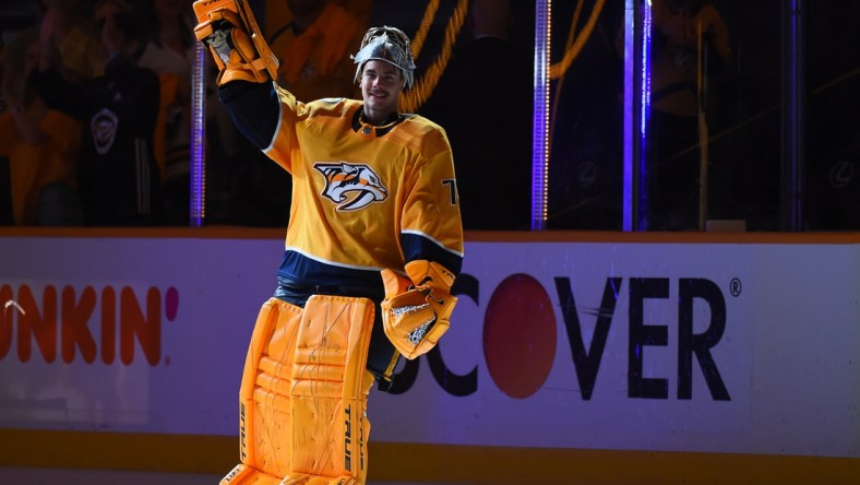 May 21, 2021; Nashville, Tennessee, USA; Nashville Predators goaltender Juuse Saros (74) waives to the crowd after being named the third star of the game after a double overtime win against the Carolina Hurricanes in game three of the first round of the 2021 Stanley Cup Playoffs at Bridgestone Arena. Mandatory Credit: Christopher Hanewinckel-USA TODAY Sports