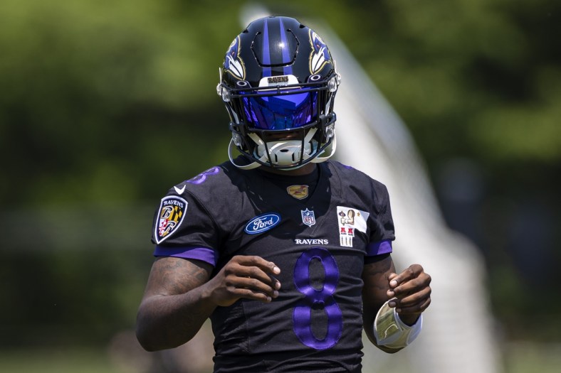 May 26, 2021; Owings Mills, Maryland, USA; Baltimore Ravens quarterback Lamar Jackson (8) looks on during an OTA at Under Armour Performance Center. Mandatory Credit: Scott Taetsch-USA TODAY Sports
