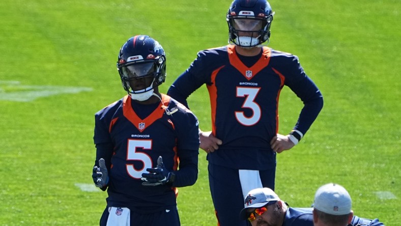 Jun 1, 2021; Englewood, Colorado, USA; Denver Broncos quarterback Teddy Bridgewater (5) and quarterback Drew Lock (3) during organized team activities at the UCHealth Training Center. Mandatory Credit: Ron Chenoy-USA TODAY Sports