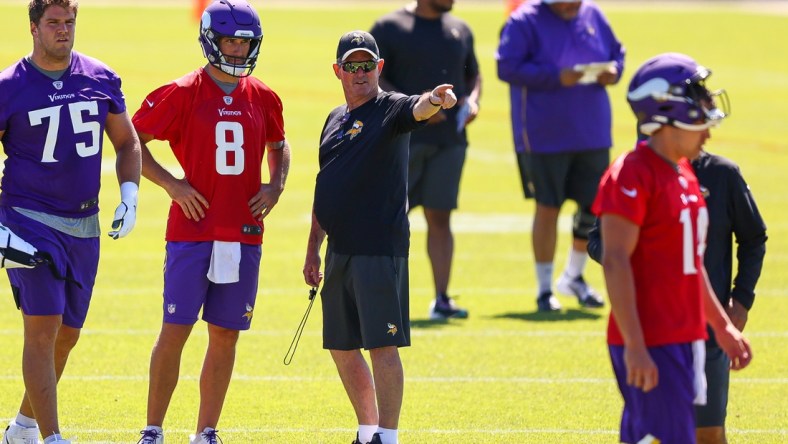 Jun 15, 2021; in Eagen, Minnesota, USA; Minnesota Vikings head coach Mike Zimmer and quarterback Kirk Cousins (8) talk during drills at OTA at TCO Performance Center. Mandatory Credit: Harrison Barden-USA TODAY Sports