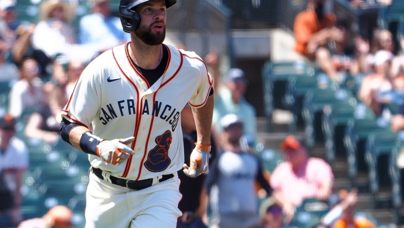 Jun 19, 2021; San Francisco, California, USA; San Francisco Giants first baseman Brandon Belt (9) hits a home run against the Philadelphia Phillies during the third inning at Oracle Park. Mandatory Credit: Kelley L Cox-USA TODAY Sports