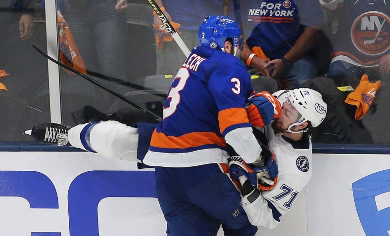 Jun 23, 2021; Uniondale, New York, USA; Tampa Bay Lightning center Anthony Cirelli (71) is checked by New York Islanders defenseman Adam Pelech (3) during the third period in game six of the 2021 Stanley Cup Semifinals at Nassau Veterans Memorial Coliseum. Mandatory Credit: Andy Marlin-USA TODAY Sports