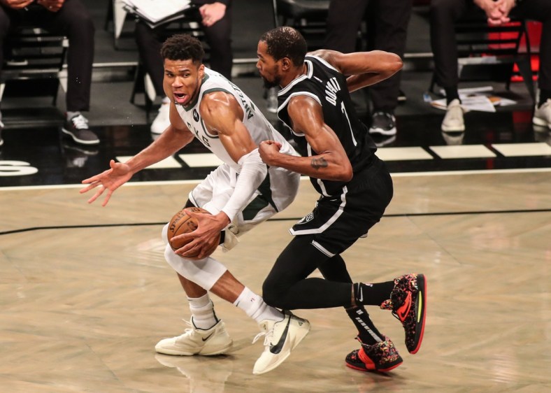 Jun 19, 2021; Brooklyn, New York, USA; Milwaukee Bucks forward Giannis Antetokounmpo (34) and Brooklyn Nets forward Kevin Durant (7) during game seven in the second round of the 2021 NBA Playoffs at Barclays Center. Mandatory Credit: Wendell Cruz-USA TODAY Sports